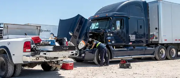 photo showing mobile mechanic repairing a semi truck